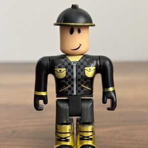 ROBLOX Action Figure OUTRAGEOUS BUILDERMAN Toy Jazwares Black & Gold RARE